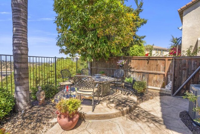 320 Corte Castillo, Chula Vista, CA 91914 - fenced backyard featuring a patio area and outdoor dining space