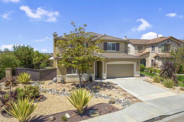 320 Corte Castillo, Chula Vista, CA 91914 - view of front of home featuring stucco siding, a tile roof, driveway, and an attached garage