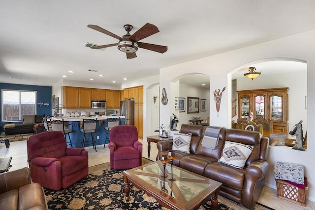 320 Corte Castillo, Chula Vista, CA 91914 - living area with arched walkways, a ceiling fan, recessed lighting, and light tile patterned flooring