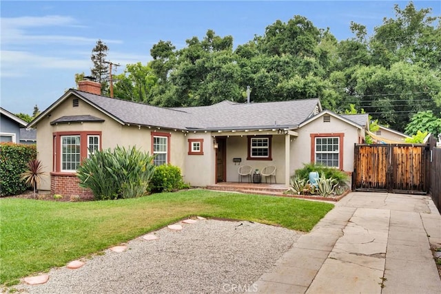 825 E Palm Ave, Monrovia, CA 91016 - ranch-style home with stucco siding, a chimney, roof with shingles, and a porch