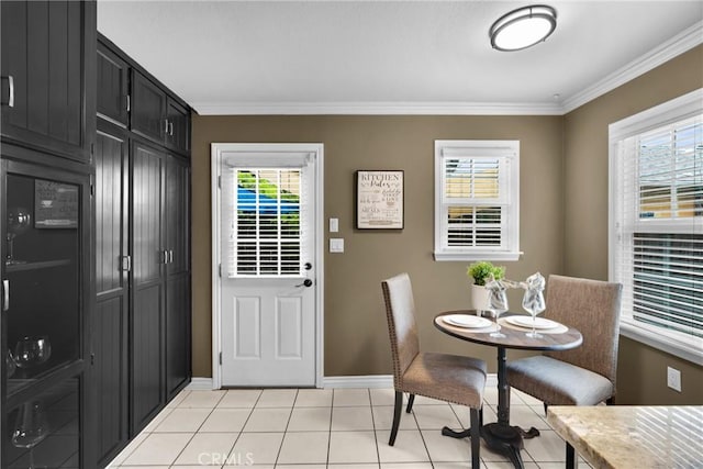 825 E Palm Ave, Monrovia, CA 91016 - dining space with crown molding, baseboards, and light tile patterned floors