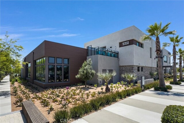11047 Wander Dr, Rancho Cucamonga, CA 91730 - view of side of property featuring stone siding