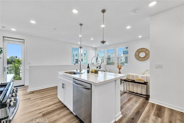 11047 Wander Dr, Rancho Cucamonga, CA 91730 - kitchen with appliances with stainless steel finishes, a sink, white cabinets, recessed lighting, and light countertops