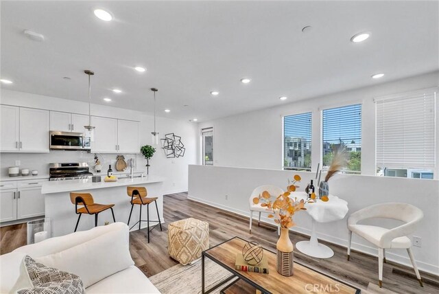11047 Wander Dr, Rancho Cucamonga, CA 91730 - living room featuring recessed lighting, dark wood finished floors, and baseboards