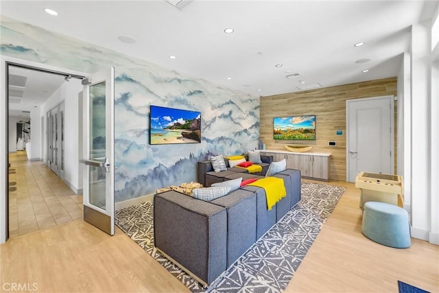 11047 Wander Dr, Rancho Cucamonga, CA 91730 - living area featuring an accent wall, recessed lighting, light wood-style flooring, wallpapered walls, and french doors