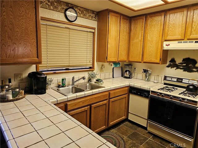 43133 Moonridge Rd, Big Bear, CA 92315 - kitchen with range with gas stovetop, under cabinet range hood, dishwashing machine, a sink, and tile counters