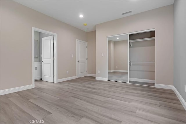 22022 Pioneer Blvd Unit A & B, Hawaiian Gardens, CA 90716 - unfurnished bedroom with light wood-type flooring, a closet, recessed lighting, and connected bathroom