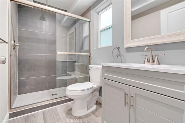 22022 Pioneer Blvd Unit A & B, Hawaiian Gardens, CA 90716 - bathroom featuring vanity, a shower stall, and wood finished floors
