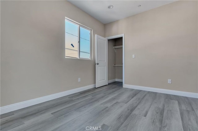 22022 Pioneer Blvd Unit A & B, Hawaiian Gardens, CA 90716 - unfurnished bedroom featuring wood finished floors and a closet