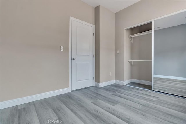 22022 Pioneer Blvd Unit A & B, Hawaiian Gardens, CA 90716 - unfurnished bedroom featuring wood finished floors and a closet