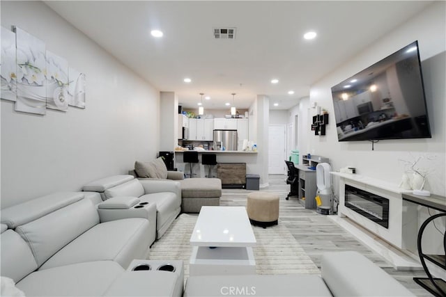 12668 Chapman Ave Unit 2108, Garden Grove, CA 92840 - living area with recessed lighting and light wood-style floors
