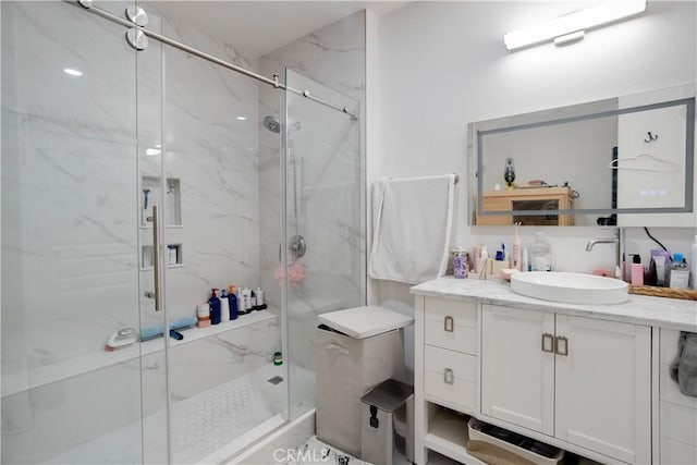 12668 Chapman Ave Unit 2108, Garden Grove, CA 92840 - bathroom with vanity and a marble finish shower