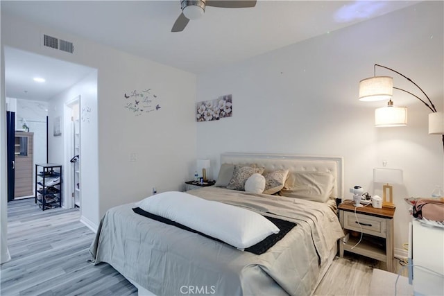 12668 Chapman Ave Unit 2108, Garden Grove, CA 92840 - bedroom with light wood finished floors, baseboards, and ceiling fan