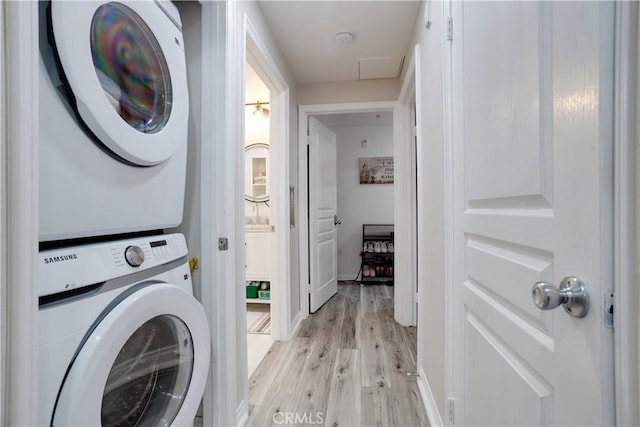 12668 Chapman Ave Unit 2108, Garden Grove, CA 92840 - laundry area with estacked washer and dryer and light wood-style flooring