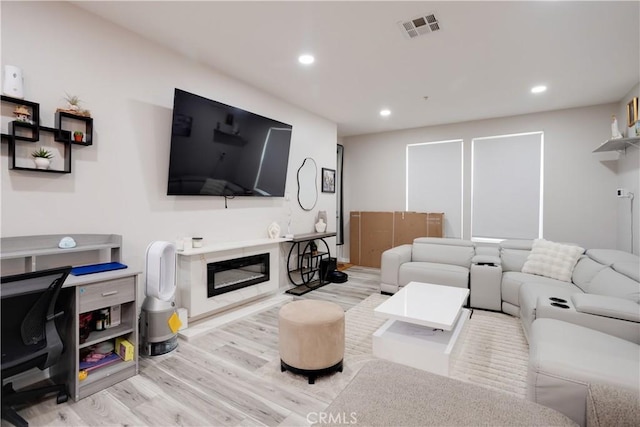 12668 Chapman Ave Unit 2108, Garden Grove, CA 92840 - living room with wood finished floors, recessed lighting, and a glass covered fireplace