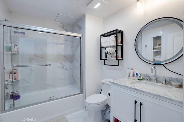 12668 Chapman Ave Unit 2108, Garden Grove, CA 92840 - full bathroom with vanity, shower / bath combination with glass door, and marble look tiles