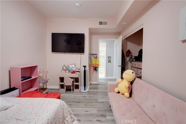 12668 Chapman Ave Unit 2108, Garden Grove, CA 92840 - bedroom with light wood finished floors and baseboards