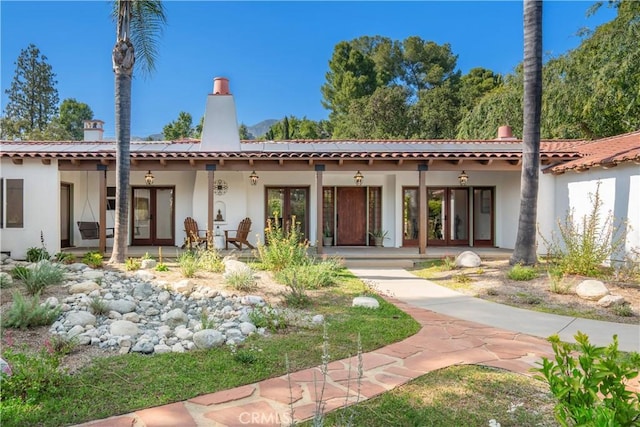 1247 Journeys End Dr, La Canada Flintridge, CA 91011 - rear view of house with stucco siding and a chimney