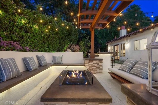 1247 Journeys End Dr, La Canada Flintridge, CA 91011 - patio at twilight featuring an outdoor living space with a fire pit and a patio