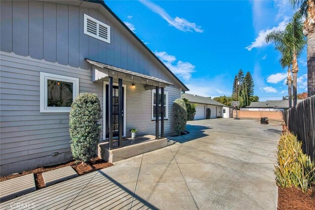 343 W Fletcher Ave, Orange, CA 92865 - view of side of home with a garage and board and batten siding