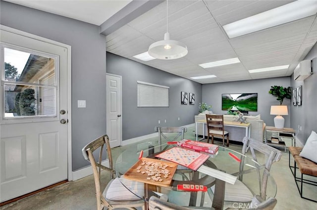 343 W Fletcher Ave, Orange, CA 92865 - dining space featuring concrete flooring, baseboards, and an AC wall unit