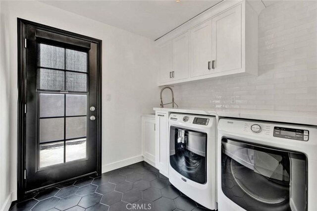 343 W Fletcher Ave, Orange, CA 92865 - laundry area featuring washer and clothes dryer, cabinet space, dark tile patterned flooring, and baseboards