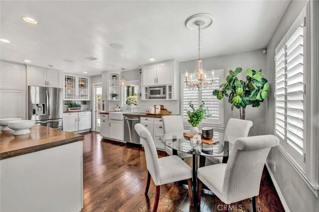 343 W Fletcher Ave, Orange, CA 92865 - dining space featuring a chandelier, dark wood-type flooring, recessed lighting, and baseboards