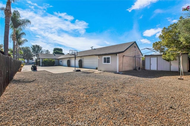 343 W Fletcher Ave, Orange, CA 92865 - rear view of property featuring a garage and concrete driveway