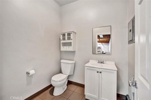 343 W Fletcher Ave, Orange, CA 92865 - bathroom with toilet, vanity, baseboards, and tile patterned flooring