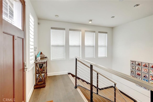 2393 Ocean St, Carlsbad, CA 92008 - hall featuring an upstairs landing, wood finished floors, baseboards, and recessed lighting