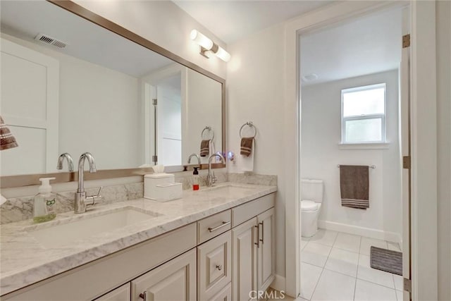 2393 Ocean St, Carlsbad, CA 92008 - full bath featuring double vanity, tile patterned floors, toilet, and baseboards