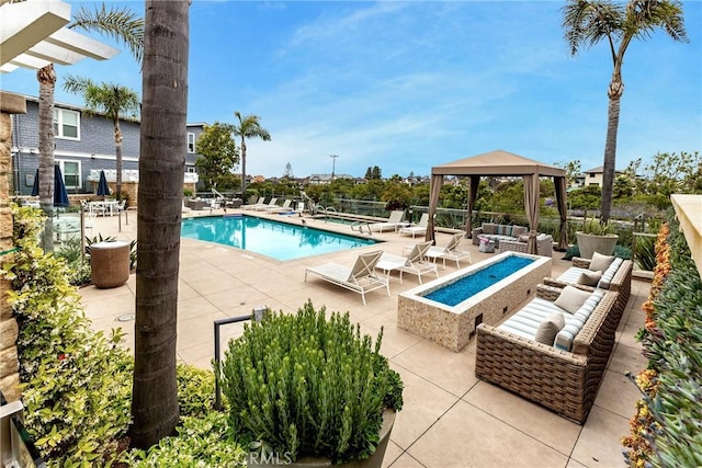 2393 Ocean St, Carlsbad, CA 92008 - community pool with an outdoor living space with a fire pit, a gazebo, and a patio area