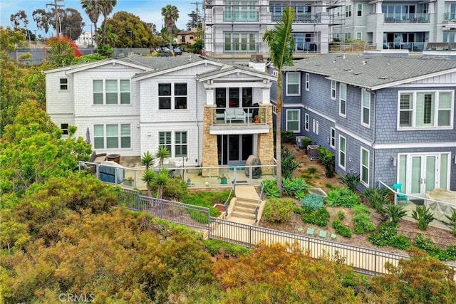 2393 Ocean St, Carlsbad, CA 92008 - rear view of house with a fenced backyard and a balcony