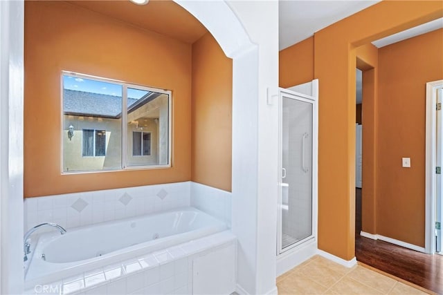 1550 Strawberry Ave, Arroyo Grande, CA 93420 - bathroom featuring a stall shower, a whirlpool tub, and baseboards