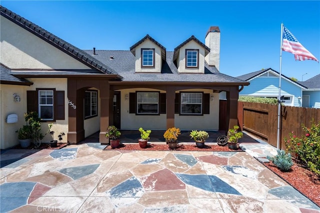 1550 Strawberry Ave, Arroyo Grande, CA 93420 - view of front facade with a chimney, stucco siding, and roof with shingles