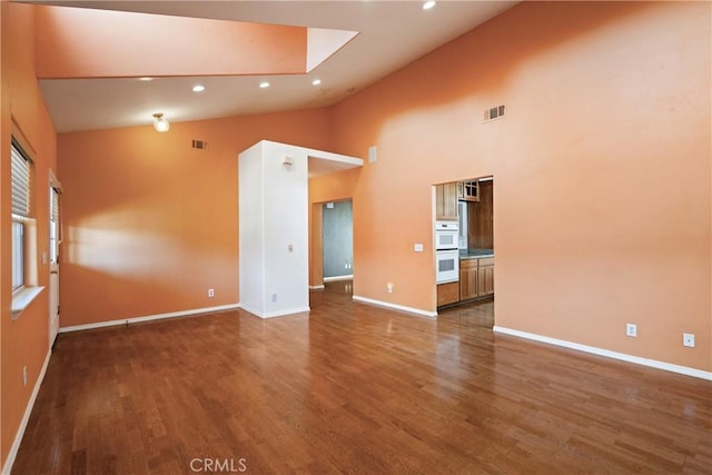 1550 Strawberry Ave, Arroyo Grande, CA 93420 - unfurnished room featuring wood finished floors, baseboards, high vaulted ceiling, and recessed lighting