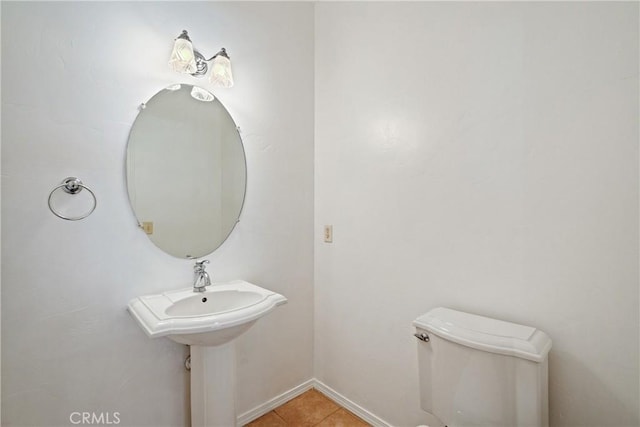1550 Strawberry Ave, Arroyo Grande, CA 93420 - half bath featuring toilet, tile patterned flooring, and baseboards