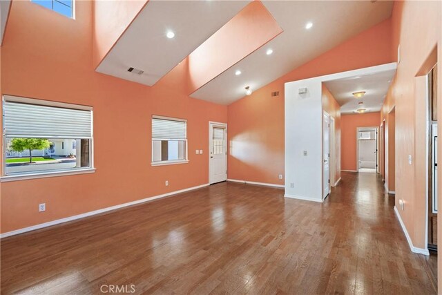 1550 Strawberry Ave, Arroyo Grande, CA 93420 - unfurnished room featuring high vaulted ceiling, wood finished floors, plenty of natural light, baseboards, and recessed lighting