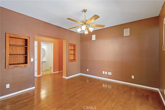 1550 Strawberry Ave, Arroyo Grande, CA 93420 - empty room with a ceiling fan, wood finished floors, and baseboards