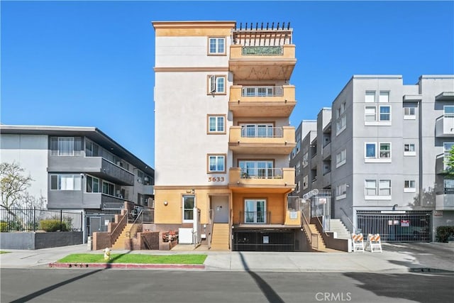 5633 Carlton Way Unit 503, Hollywood, CA 90028 - view of apartment building / complex featuring stairway