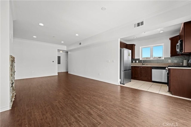 5633 Carlton Way Unit 503, Hollywood, CA 90028 - unfurnished living room with crown molding, a sink, light wood-style flooring, baseboards, and recessed lighting