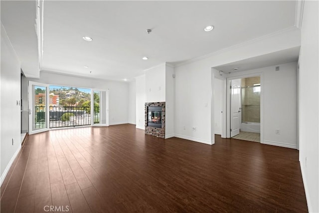 5633 Carlton Way Unit 503, Hollywood, CA 90028 - unfurnished living room featuring dark wood-style floors, baseboards, recessed lighting, ornamental molding, and a fireplace