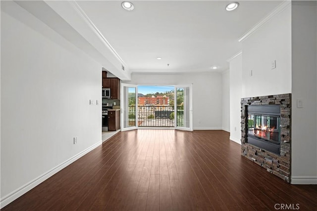 5633 Carlton Way Unit 503, Hollywood, CA 90028 - unfurnished living room with a fireplace, dark wood-style floors, crown molding, baseboards, and recessed lighting