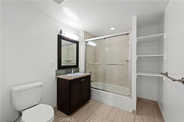 5633 Carlton Way Unit 503, Hollywood, CA 90028 - full bathroom featuring toilet, vanity, shower / bath combination with glass door, and tile patterned flooring