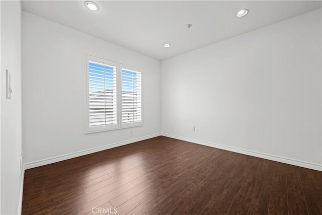 5633 Carlton Way Unit 503, Hollywood, CA 90028 - spare room featuring dark wood-type flooring, baseboards, and recessed lighting
