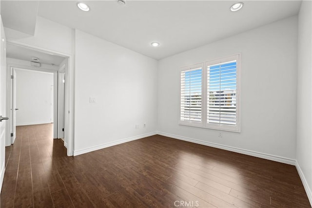 5633 Carlton Way Unit 503, Hollywood, CA 90028 - empty room with baseboards, dark wood-style flooring, and recessed lighting