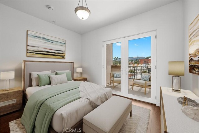 5633 Carlton Way Unit 503, Hollywood, CA 90028 - bedroom featuring access to outside and wood finished floors