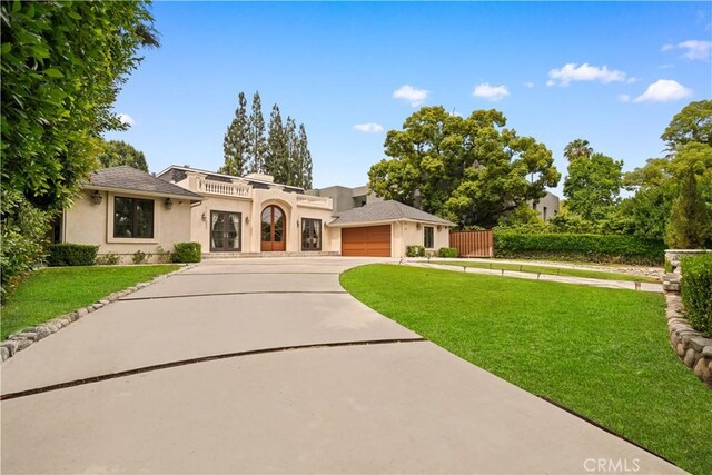 325 W Bellevue Dr, Pasadena, CA 91105 - mediterranean / spanish home featuring stucco siding, driveway, and a garage