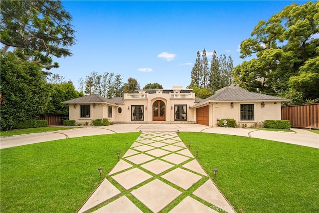 325 W Bellevue Dr, Pasadena, CA 91105 - view of front facade with driveway, stucco siding, french doors, and a garage