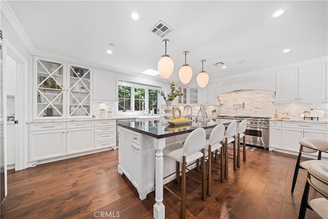 325 W Bellevue Dr, Pasadena, CA 91105 - kitchen featuring high end stainless steel range, ornamental molding, backsplash, white cabinets, and custom range hood